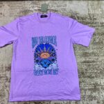 Lavender streetwear graphic t-shirt featuring a mystical sun face, stars, and clouds with 'Create More Art' and 'Read The Cosmos' text, custom DTF printed by Whavieprints.