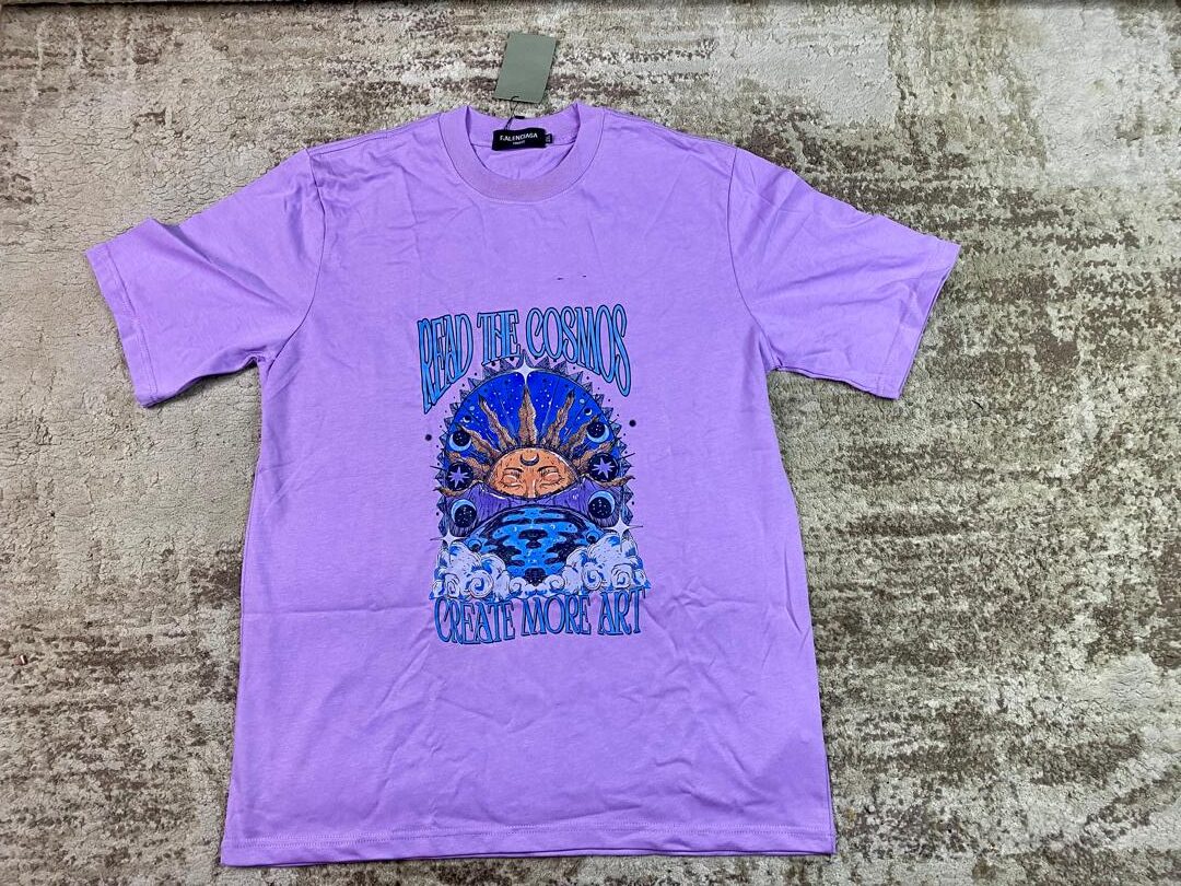 Lavender streetwear graphic t-shirt featuring a mystical sun face, stars, and clouds with 'Create More Art' and 'Read The Cosmos' text, custom DTF printed by Whavieprints.