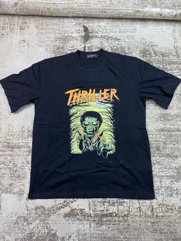 Black streetwear graphic t-shirt featuring a green-skinned zombie with glowing eyes, an eerie forest background, and jagged orange 'Thriller' text, custom DTF printed by Whavieprints.