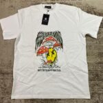 White streetwear t-shirt with a psychedelic graphic of a yellow melting smiley face and red mushrooms under the text 'Feed Your Mind With Happiness', DTF printed by Whavieprints.
