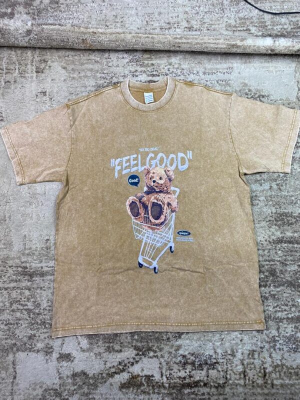 Vintage-wash brown streetwear t-shirt featuring a graphic of a brown teddy bear in a shopping cart under 'Feel Good' text, custom DTF printed by Whavieprints.