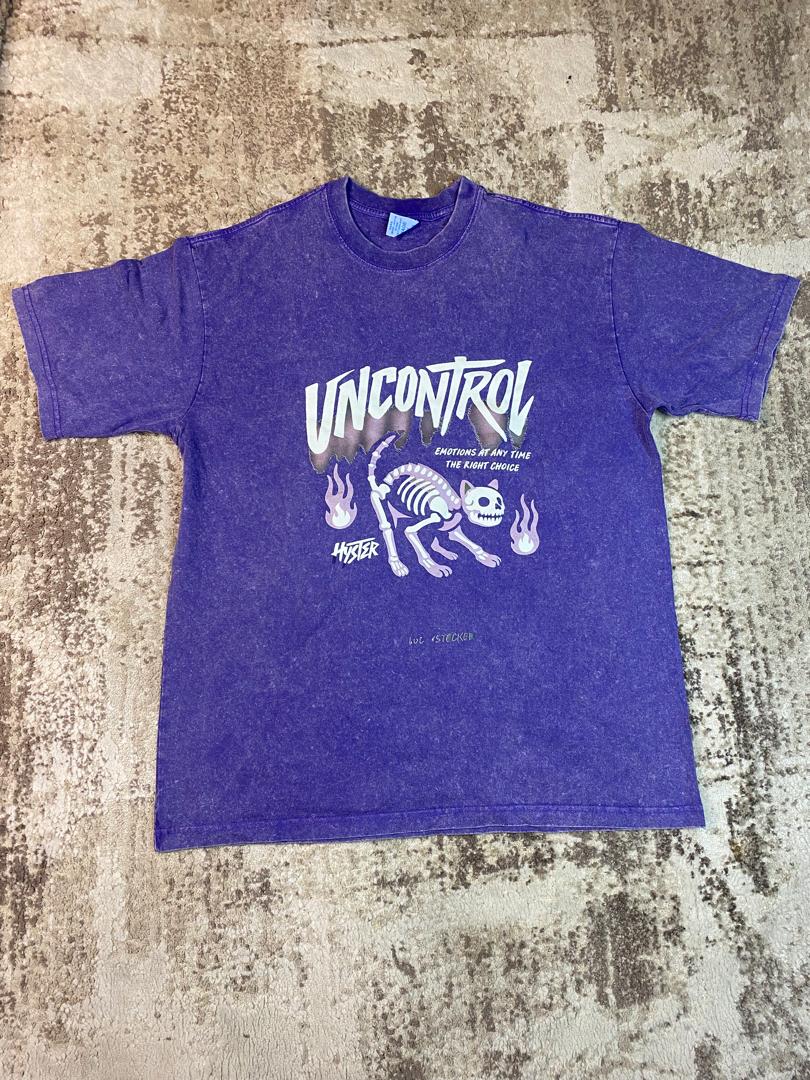 Vintage-wash purple streetwear t-shirt featuring a graphic of a white cat skeleton, purple flames, and 'Uncontrol' text, custom DTF printed by Whavieprints.